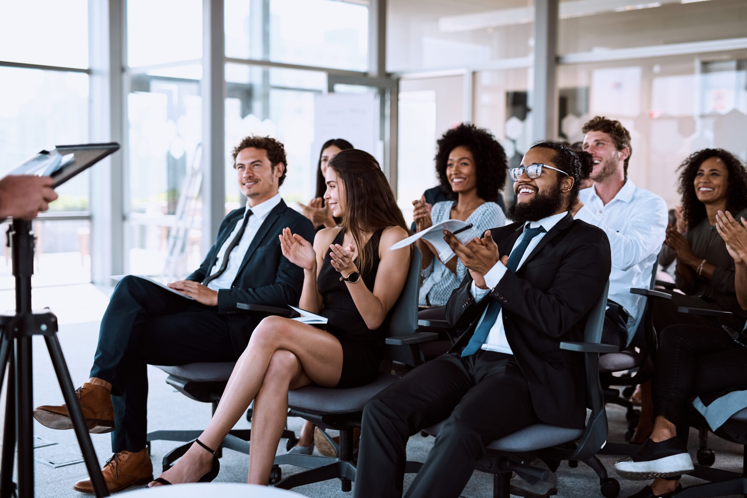 Business, people and applause for happy presentation, presenter speech and corporate training with professional. Support, career seminar and company conference with employees, clapping and crowd.